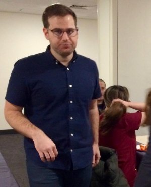 The Other Holiday Bash - A Do For One Christmas Feast While everyone else enjoyed the food and conversation, Do For One Founder Andrew Oliver was all business, making sure everyone got noticed and fed.